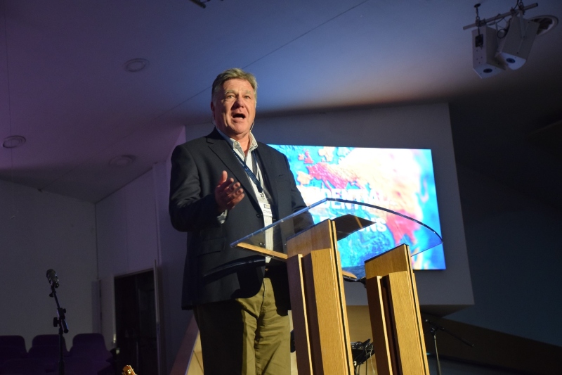 Steve Finamore speaking at a lecturn at the Baptist Assembly