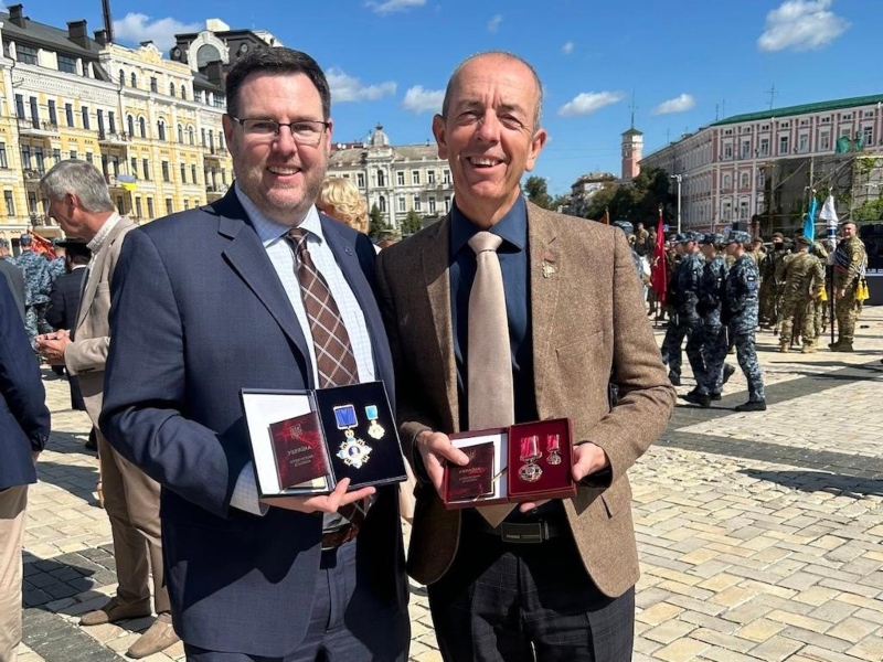 Elijah Brown and Alan Donaldson hold their Ukrainian awards