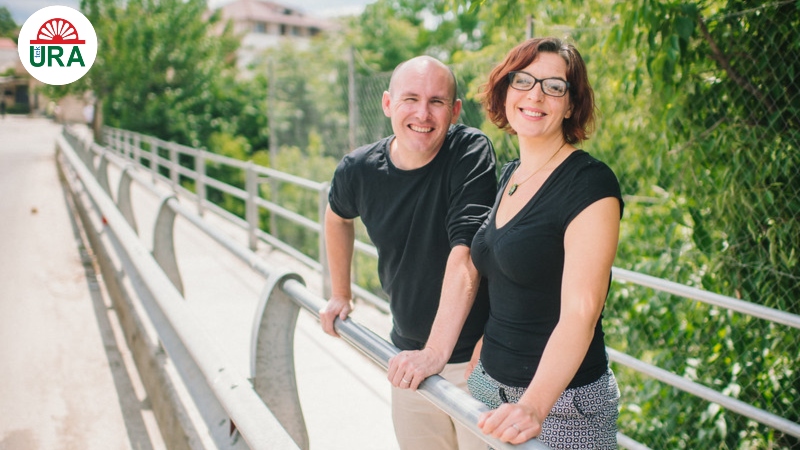 Dan and Annie Dupree standing on a bridge in Albania